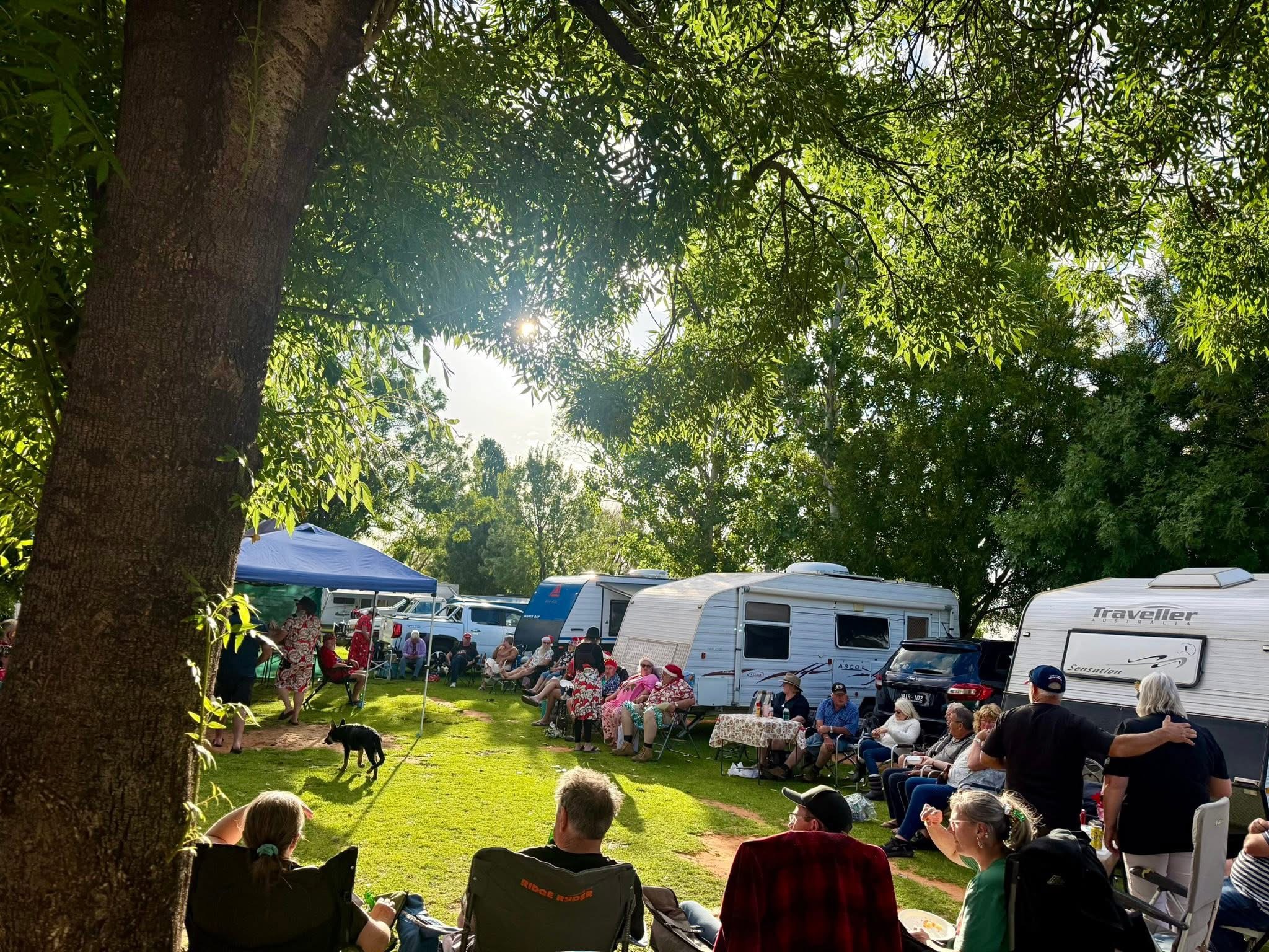 Campers gathered under the trees